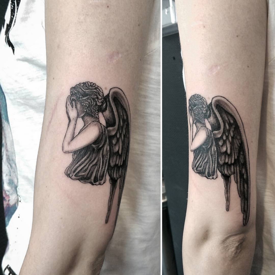 Crying angel tattoo