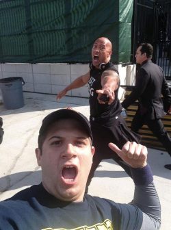 kneelift:  The Rock somehow manages to photobomb