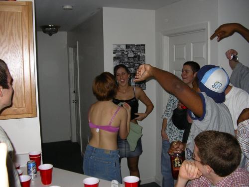 Cute girl loses at strip beer pong, gets totally naked.