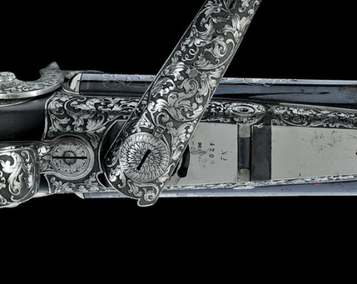 A Luxury Cased Garniture of silver decorated double barrel pinfire pistols and a double barrel pinfi