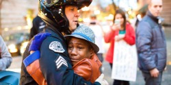 mistergoodlife:  Ferguson: a 12 year old American boy hugging a police officer during a protest that took place in Portland. The boy, Devonte Hart, was holding a “Free Hugs” sign when Sgt. Brett Barnum asked him to come forward and gave him a hug. 