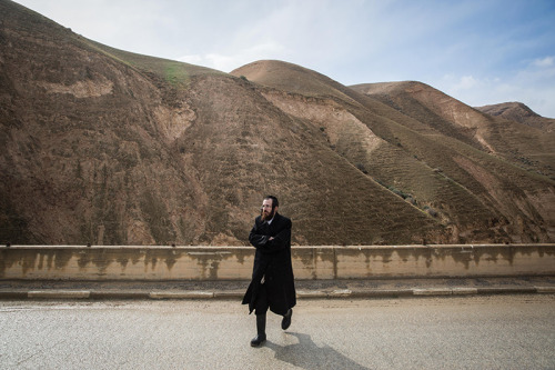 An Ultra Orthodox Jewish man seen visiting Wadi Og, in the Judean Desert, south of Jerusalem, on Jan