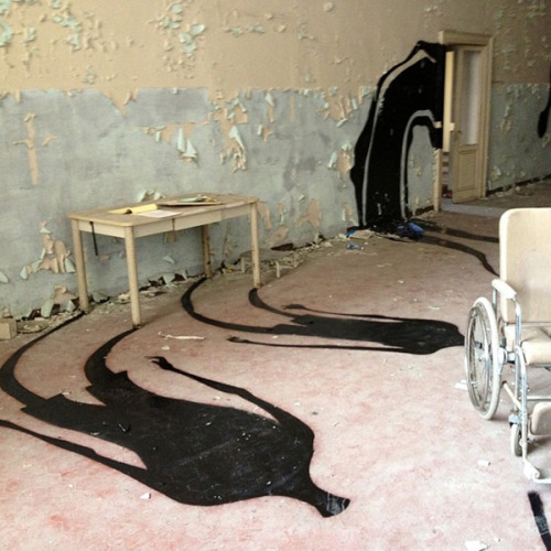 unknowneditors:  Brazilian street artist Herbert Baglione has somehow managed to make an abandoned psychiatric hospital in Parma, Italy even creepier with his paintings of shadows.  Be sure to check out Unknown Editors on Tumblr & Facebook.