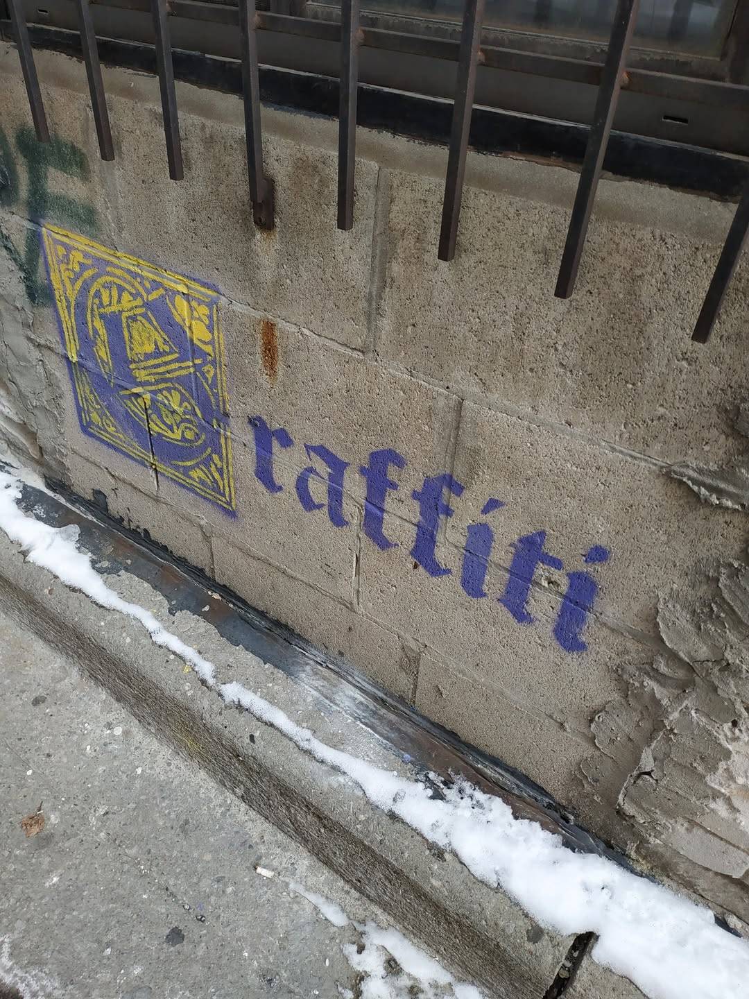 a piece of grafitti that says, in the style of medieval illumination, 'Grafitti'