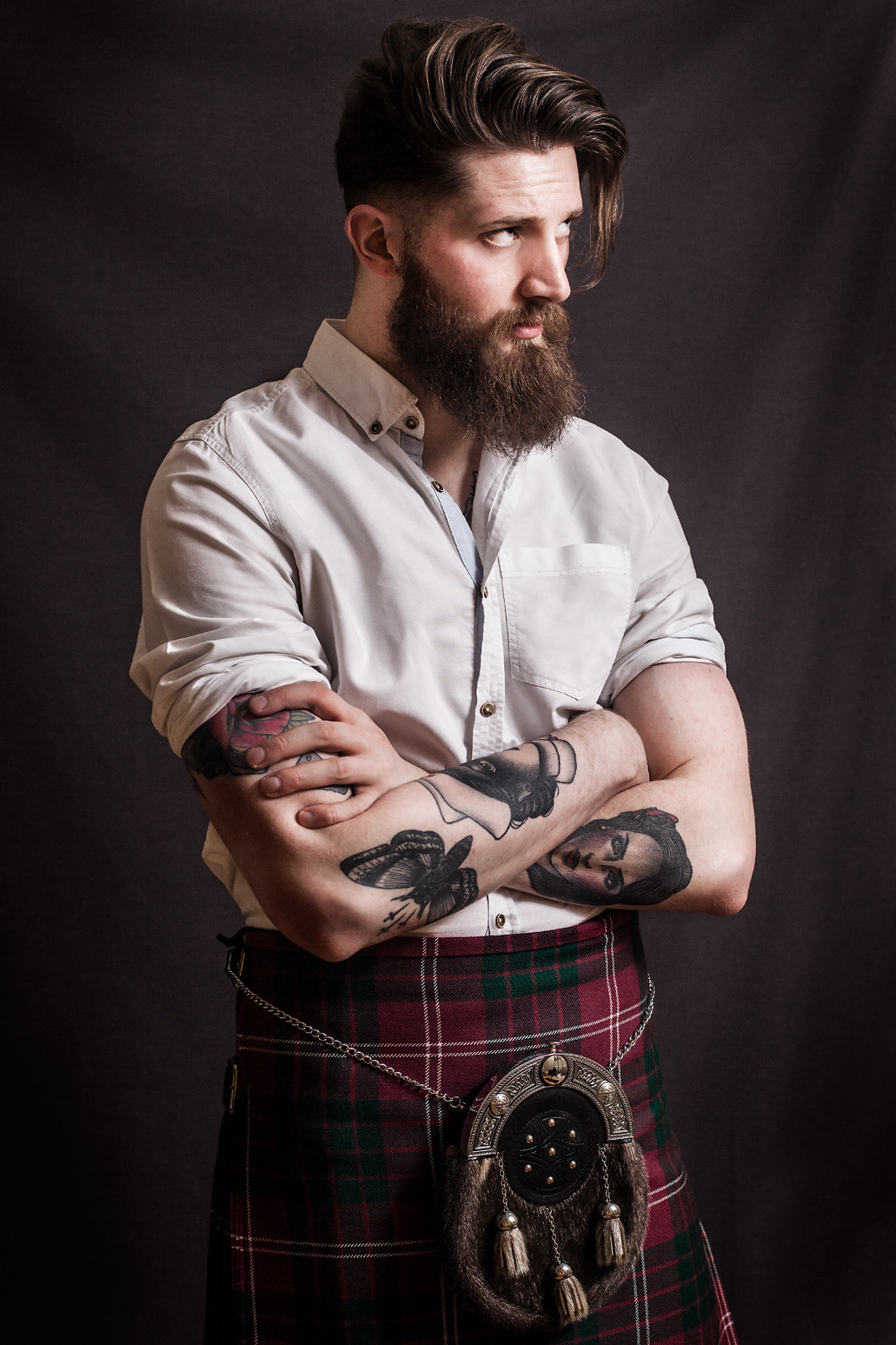 Men in kilts with tattoos