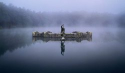 sixpenceee:  A secret ballroom lies under this lake, with a statue of Neptune above it. It was built in the late 1800s by Whitaker Wright, a businessman. The roof of the ballroom is paned in translucent glass to let light filter through from the water