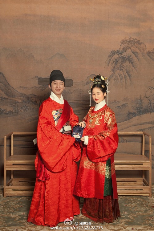 Chinese couple wearing traditional hanfu in ming dynasty wedding style and modern wedding dress. Pho