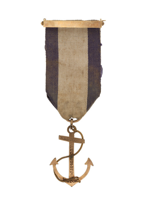 ltwilliammowett:Gold pendant, shaped like a foul anchor and inscribed with the words ‘NELSON’