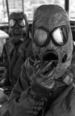 questforthegainz:  victran:  gunsandposes:  During chemical warfare training, USAF air traffic controllers direct incoming aircraft at Scott Air Force Base, Illinois, 1980. (via)  Nate calling yo mama   Our masks look way lamer than these.  