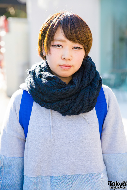20-year-old Sachiko on the street in Harajuku wearing an oversized sweatshirt from the Japanese bran