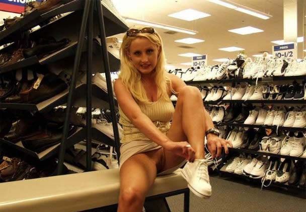 carelessinpublic:Inside a shop in a short skirt and showing her pussy