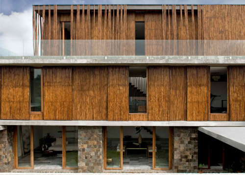 {This family home was designed by the Swiss-Filipino office of Atelier Sacha Cotture. It wraps a cen