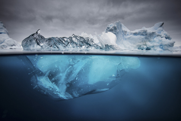 nubbsgalore:  the submerged underside of an iceberg becomes revealed when it flips,