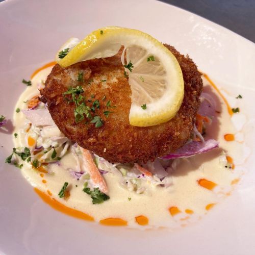 Crab cake with lump blue crab, coleslaw, dijon butter sauce.San Diego CA@topsailportsidepier••