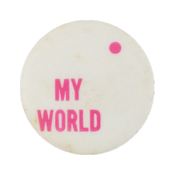 a white pin with pink text that reads 'MY WORLD'. there is a small pink dot in the top right corner