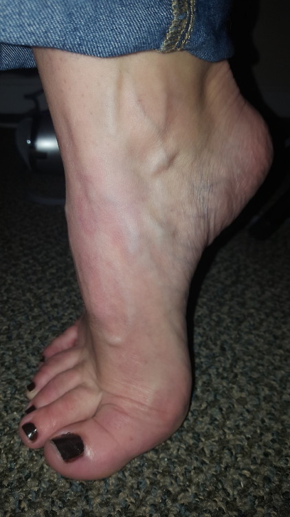 close up of her sexy candid arched foot while getting pretty after her shower.please comment