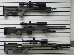 gunrunnerhell:  Triple Some rather high end bolt-action rifles. The top and bottom ones are from Desert Tactical Arms; the SRS (Stealth Recon Scout) and the HTI (Hard Target Interdiction). They have a similar silhouette and design to the German AMP DSR-1,