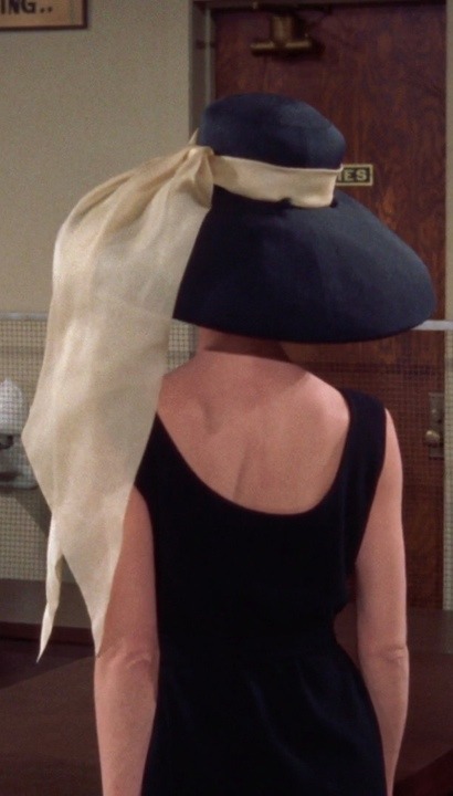 the-animation:  Audrey Hepburn in a petit noir Givenchy (cloqué silk), with a slightly flared frilly skirt, a wide-brimmed hat with an enormous cream silk bow and low-heeled alligator shoes.                                                     Breakfast