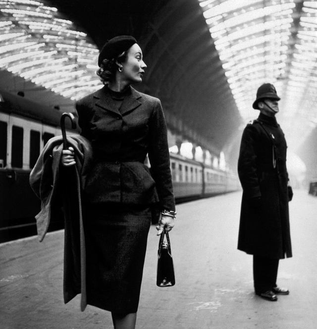 Toni Frissell. Lisa Fonssagrives at Paddington Station, London, 1951.