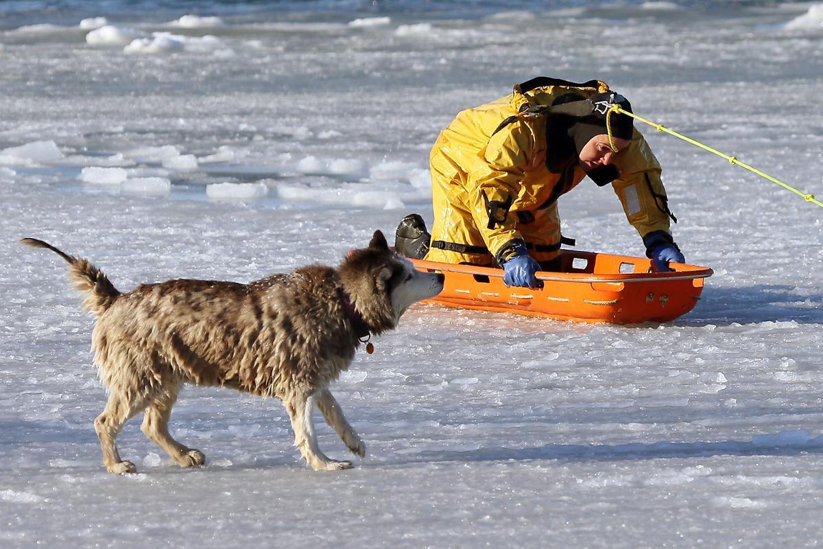 awkwardsituationist:  photos by mark garfinkel of boston firefighter sean coyle rescuing