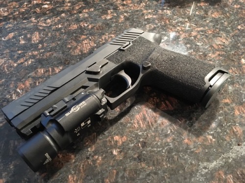 coffeeandspentbrass:red-hand-training:First Sig P320 stipple job in the booksLooks good.