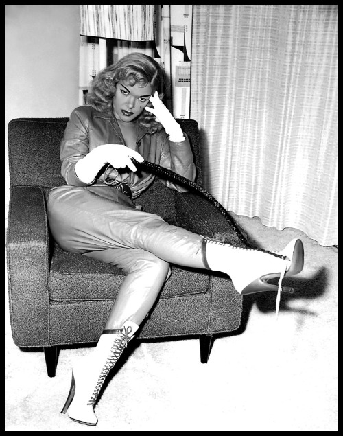 Tana Louise would like nothing better,— than to whip you!!..Photographed by  –  Leonard Burtman