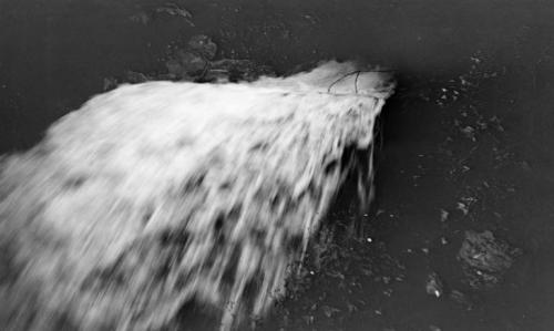 Paul Nash.   Black and white negative, waterfall, n/d.