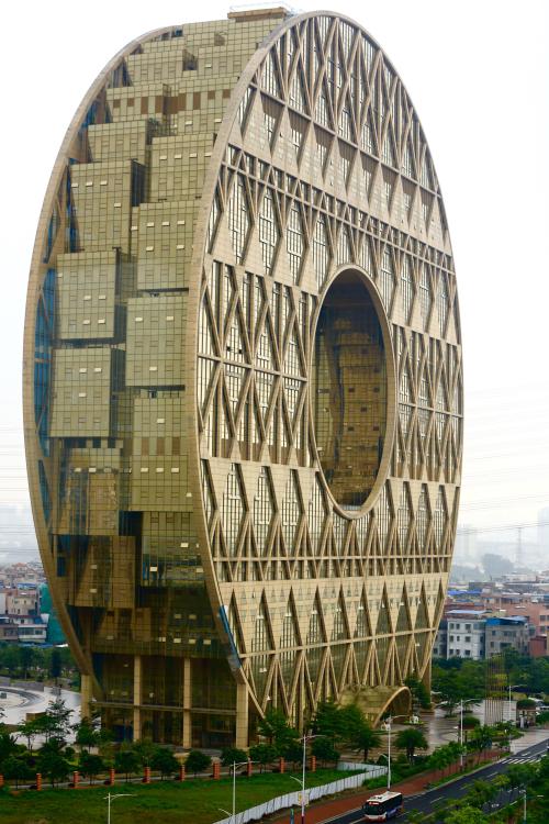 danismm: viralthings: Building in Macau giant coin  Look! It’s Gojira’s cock ring!
