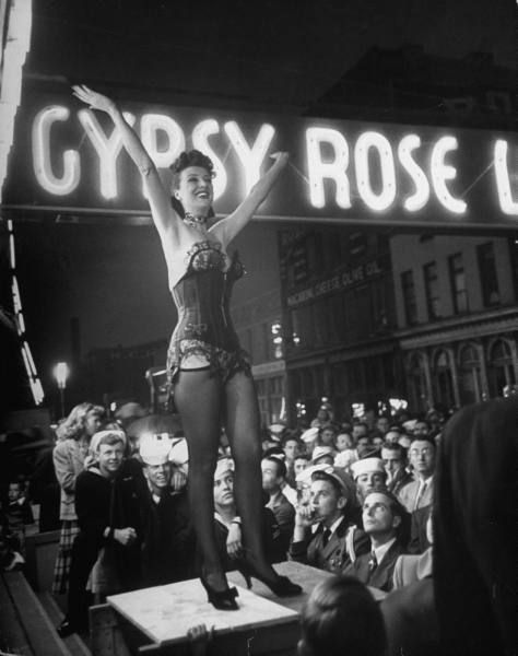 heymartini:  Gypsy Rose Lee performing her strip-tease act during a traveling carnival show. Location: Memphis, TN, US Date taken: 1954 Photographer: George Skadding
