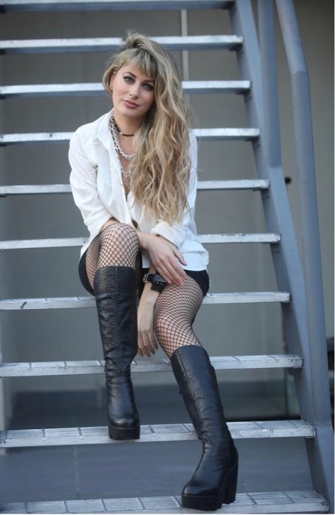 Cata Palacios wearing black #fishnets and black leather boots!...