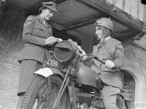 A motorcycle messenger awaits orders at the Auxiliary Territorial Service (ATS) training center, Cam