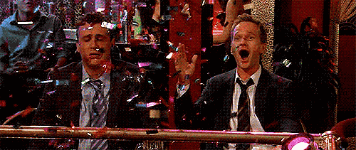Confetti falls as Barney claps for joy while Marshall looks sad.