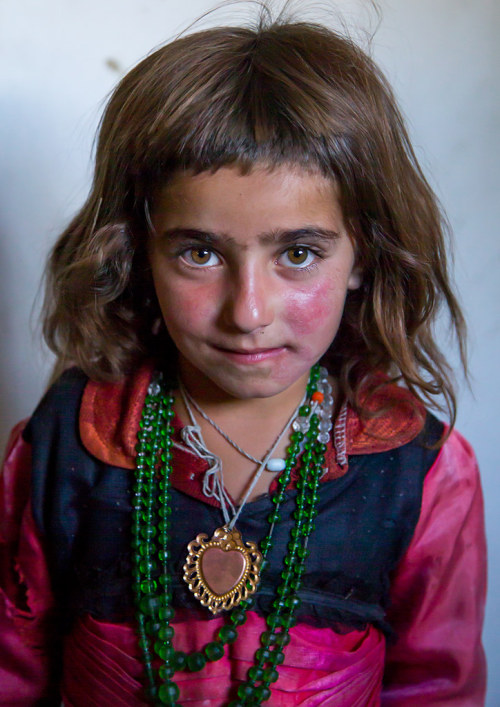 Portrait of an afghan girl with red cheeks, Badakhshan province, Khandood, Afghanistan. Taken on Aug