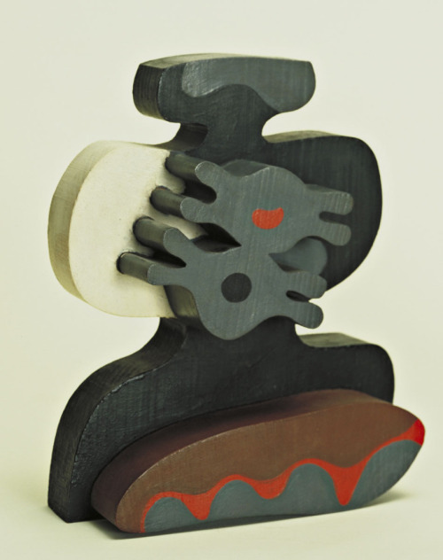 Jean (Hans) Arp, Birds in an Aquarium, 1920, painted wood, at the MoMa