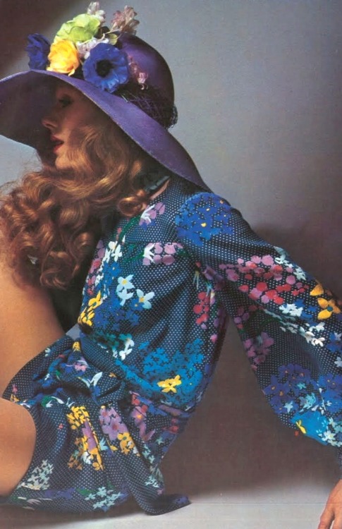 vintagefashionandbeauty: Model wearing a floral romper and hat, featured in Vogue, 1971. (x)