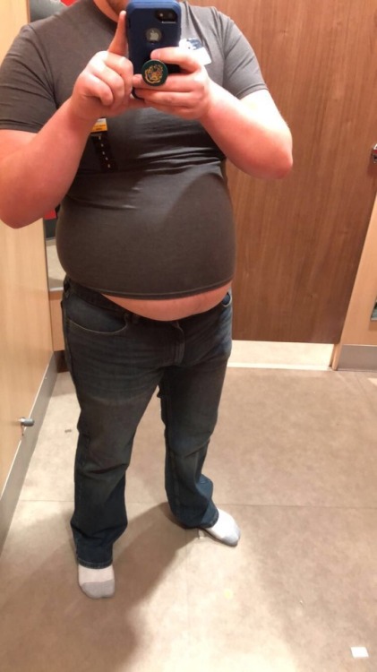 keepembloated: wellfedcollegeguy:  Had some fun in a changing room today. Tried on some 36” jeans and a S shirt (I wear  40” jeans and XL shirts 😂)  It would be fun to watch him squeeze that huge belly into those tight shirts! 