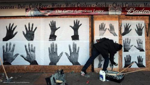 socialjusticekoolaid:  Today in Solidarity (11/19/14): St Louis artist Damon Davis turns panic into purpose, transforming boarded up stores into protest art. “They say board up. We say hands up!” #staywoke #farfromover 