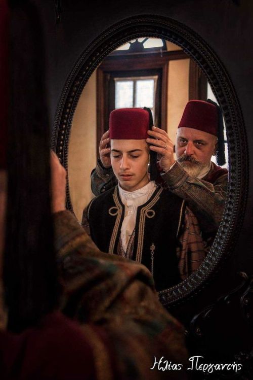 Scenes from the past. Greeks dressed in traditional attire in the Folklore Museum of Kastoria, house