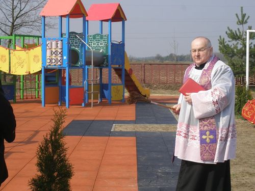 Polish priest blessing a new playground. Bogucin, 2014.