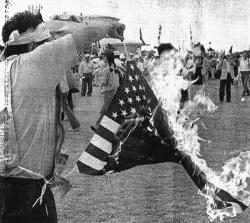sixpenceee:  The American flag is set on fire as Japanese protesters demand the closure of the U.S. military base in Okinawa, weeks after the abduction and rape of a 12-year-old girl by three U.S. servicemen. October 22, 1995. You may also like: Shadows