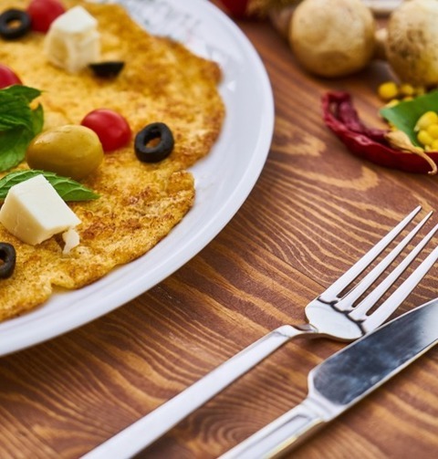 Omelette Crepe With Olives, Cheese And Tomatoes