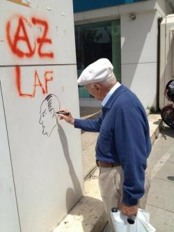 occupygezipics:  A man draws a picture of M. K. Ataturk on the wall. 