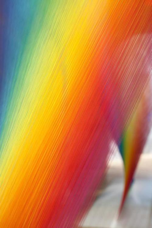 rainbowcolorfulbrightful:Mexican artist Gabriel Dawe creates a rainbow sculpture woven from over six