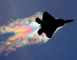 slbtumblng:  sixpenceee:  A rainbow was caught in the trail of an F-22 fighter jet. This picture was taken by Bernardo Malfitano. The low pressure around the body of the jet caused the water to condense and the angle of the sunlight was just right to