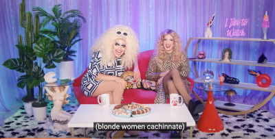Drag queens Trixie and Katya sit on a pink couch on a Netflix set. Caption reads: Blonde women cacchinate