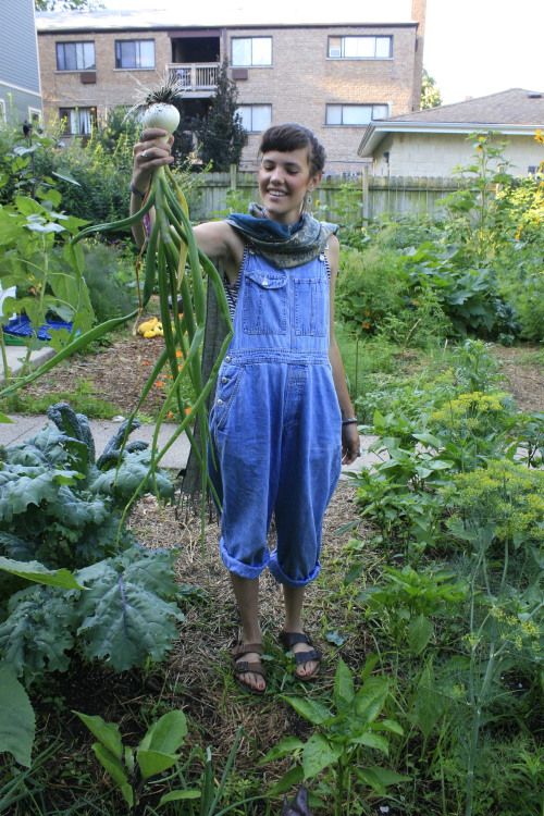 Cute friend Kendra happy with this huge onion in our Yard Share garden a few years back:D