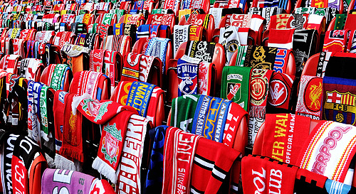 kemlyn:  Scarves donated by football fans from around the world hang on 96 empty