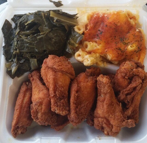 everybody-loves-to-eat:Chicken wings, greens and mac and cheese.