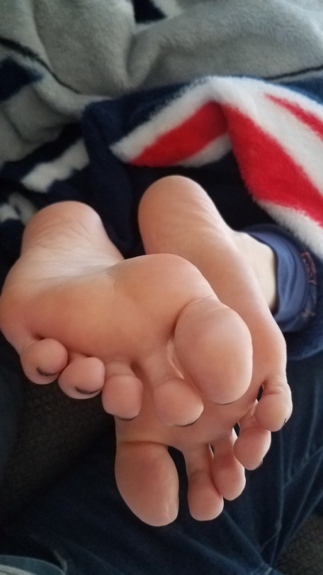 myprettywifesfeet:  My pretty wifes soft sexy soles in my lap getting some attention.please comment 