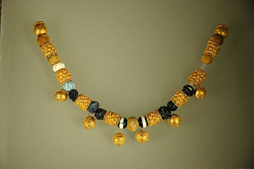 pelusian:Roman NecklaceGold and glass paste-bead necklace, 6th - 5th C BC. From a sarcophagus at Fid